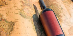 Wine,Bottle,On,World,Map,Background